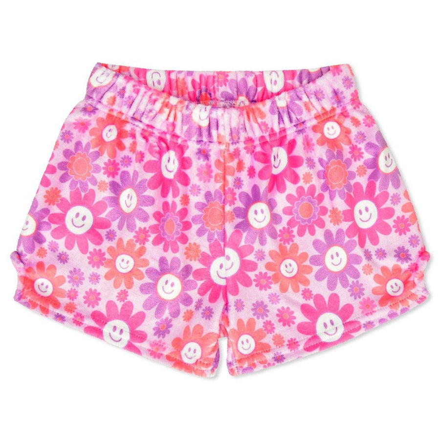 plush shorts with an elastic waist pink purple and orange colors. daisies all over. the large daisies have a smiley face in the center. 