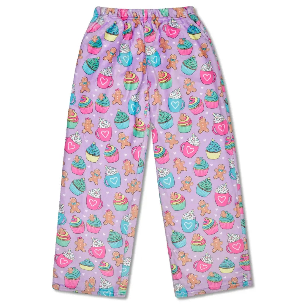Children's pajama pants with cupcake and gingerbread man pattern on a light purple background