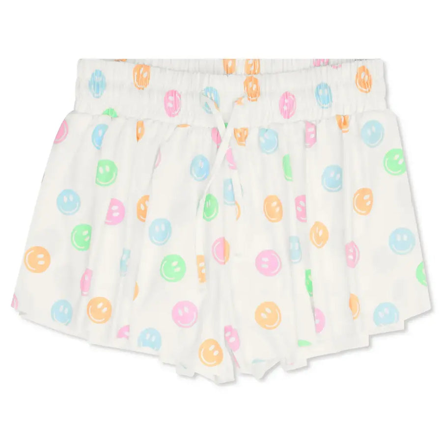 Pair of white shorts with colorful donut pattern on a white background