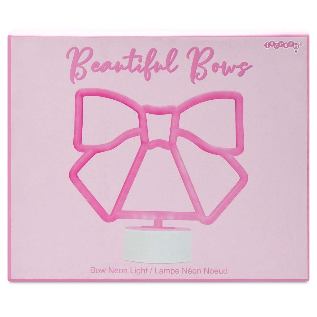 Neon Bow light in a pink box with picture of neon light on front. 