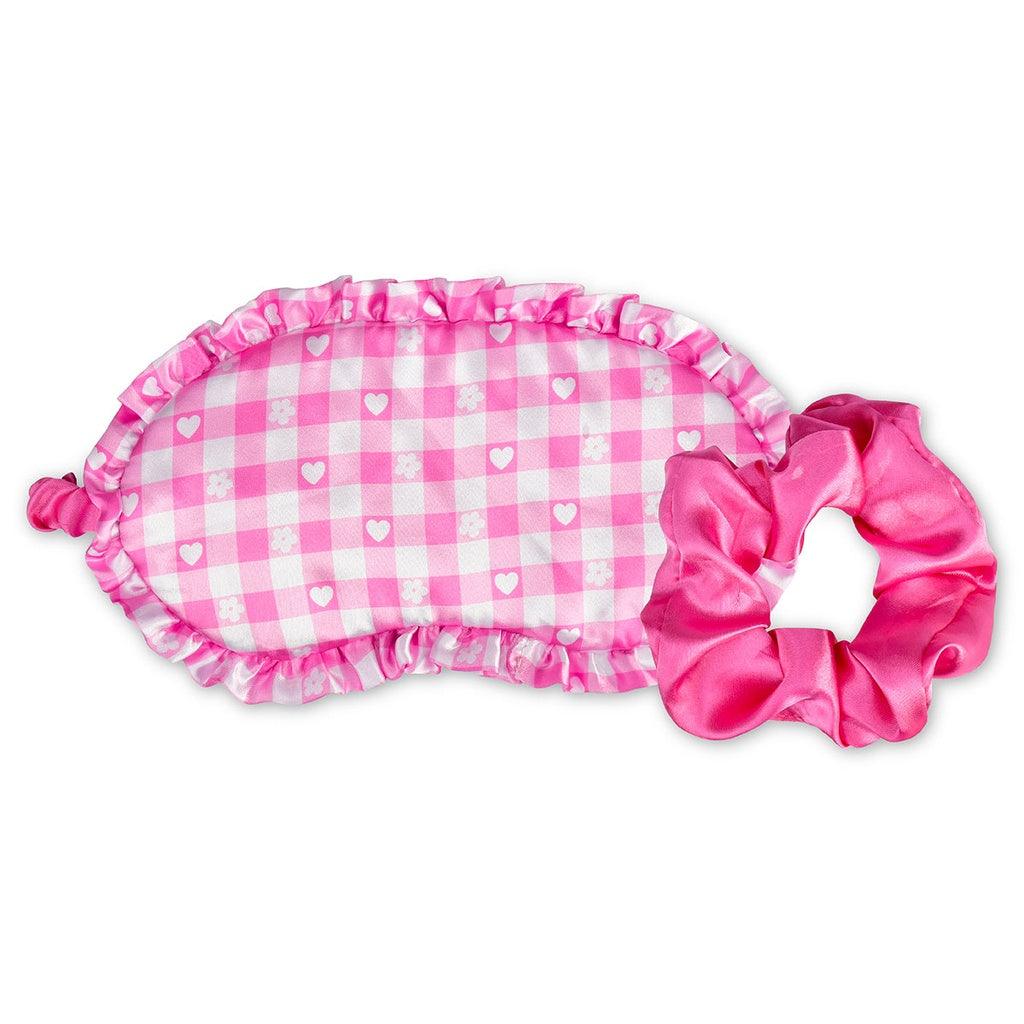pink and white gingham print eye mask and solid pink scrunchie. 