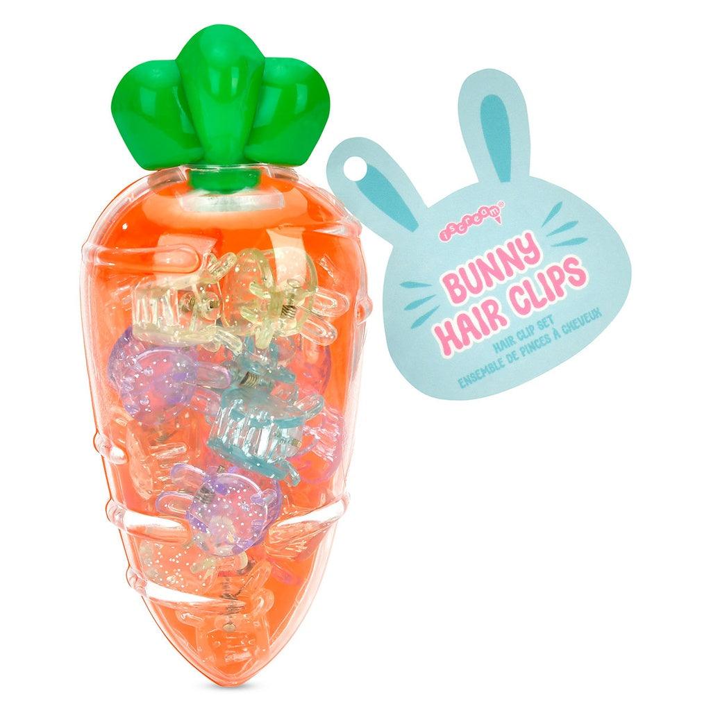 large plastic container shaped like an orange carrot with tiny bunny head clips inside, the clips are pastel multi colored and sparkly