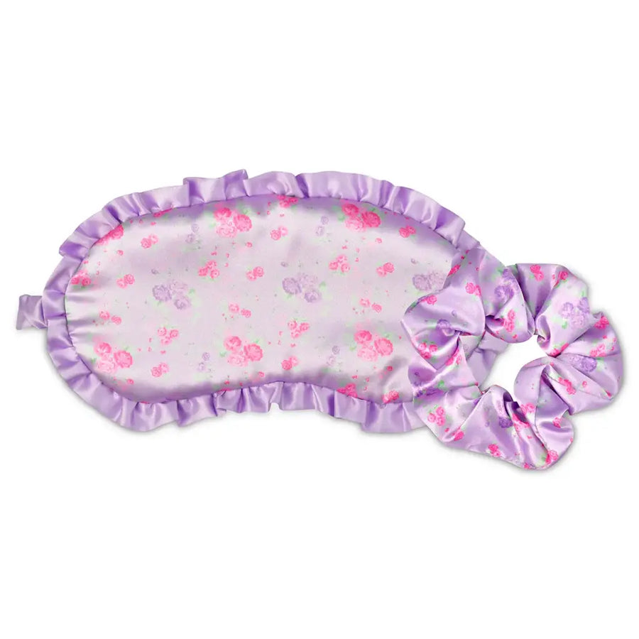 Floral eye mask and scrunchie set with purple trim on a white background