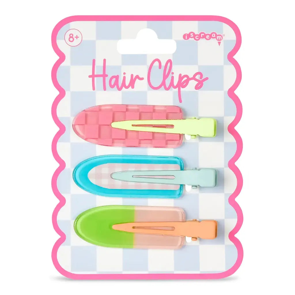 Packaged hair clips with colorful clips on a checkered background