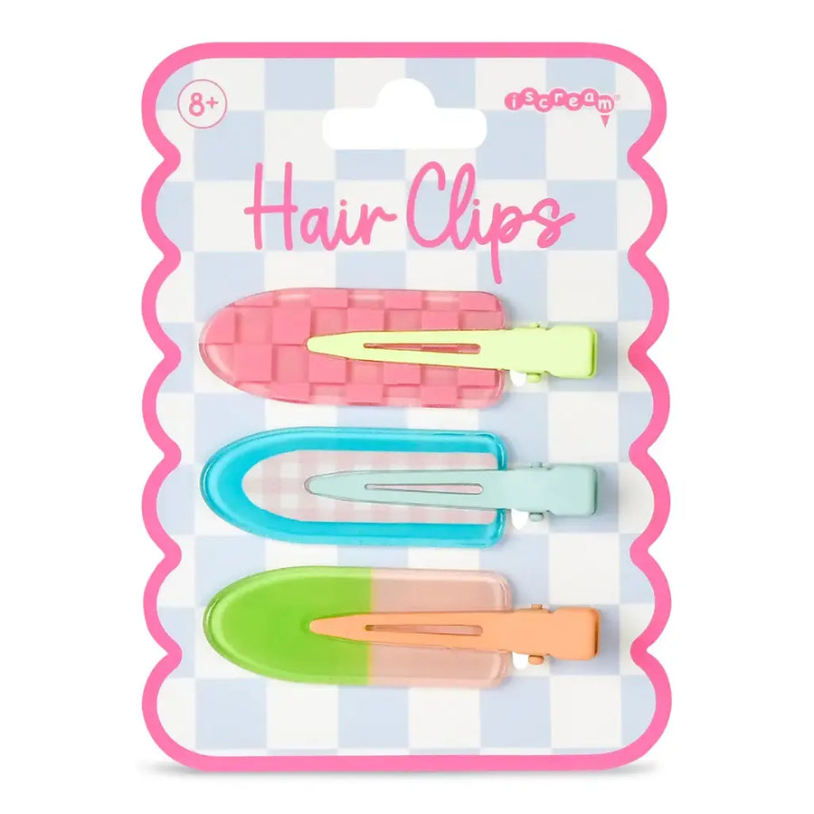 Packaged hair clips with colorful clips on a checkered background