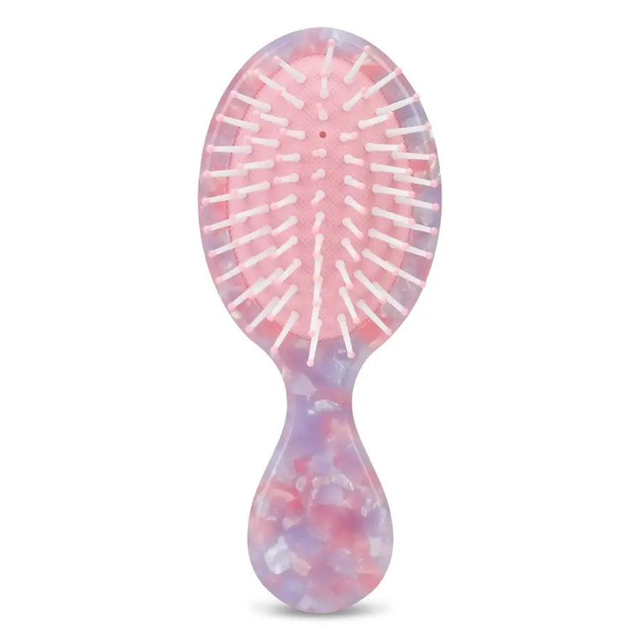 Tie-dye hairbrush on a white background