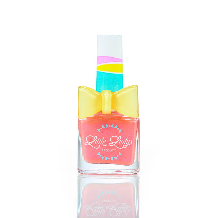 coral nail polish with a subtle shimmer and a yellow ring on top of the bottle 
