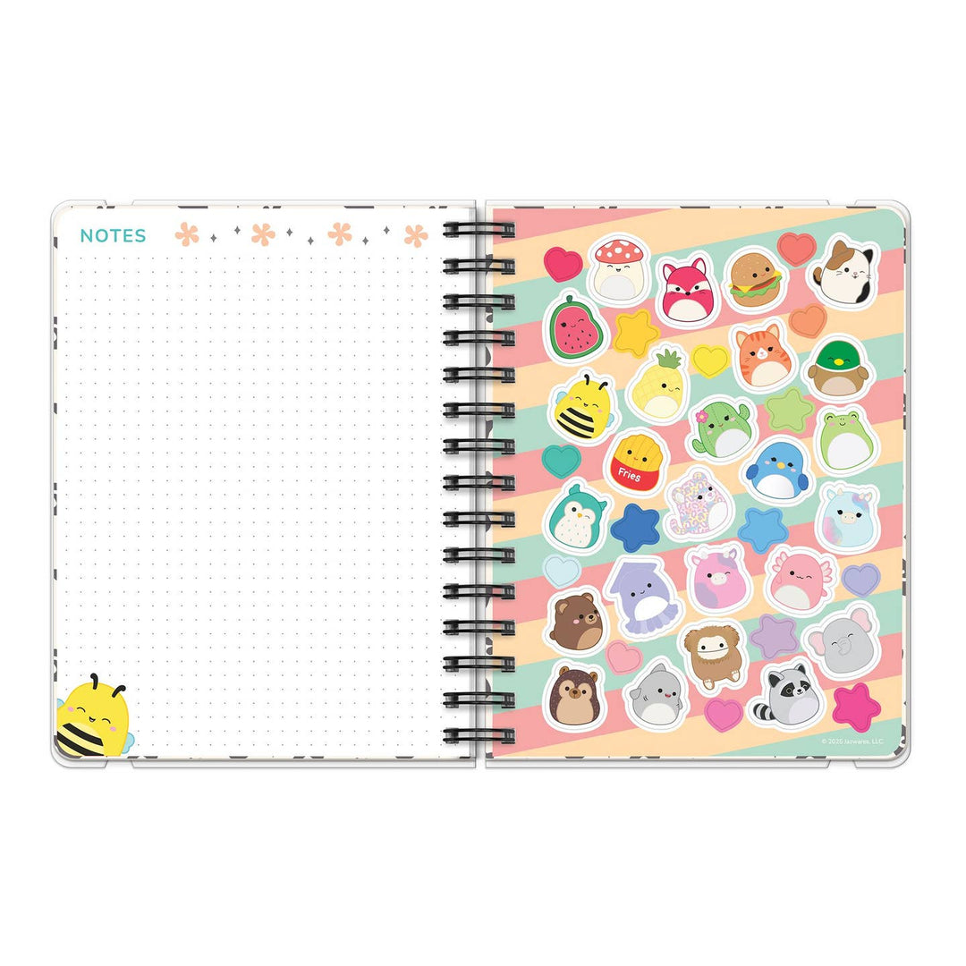 Notebook with colorful animal stickers on a white background