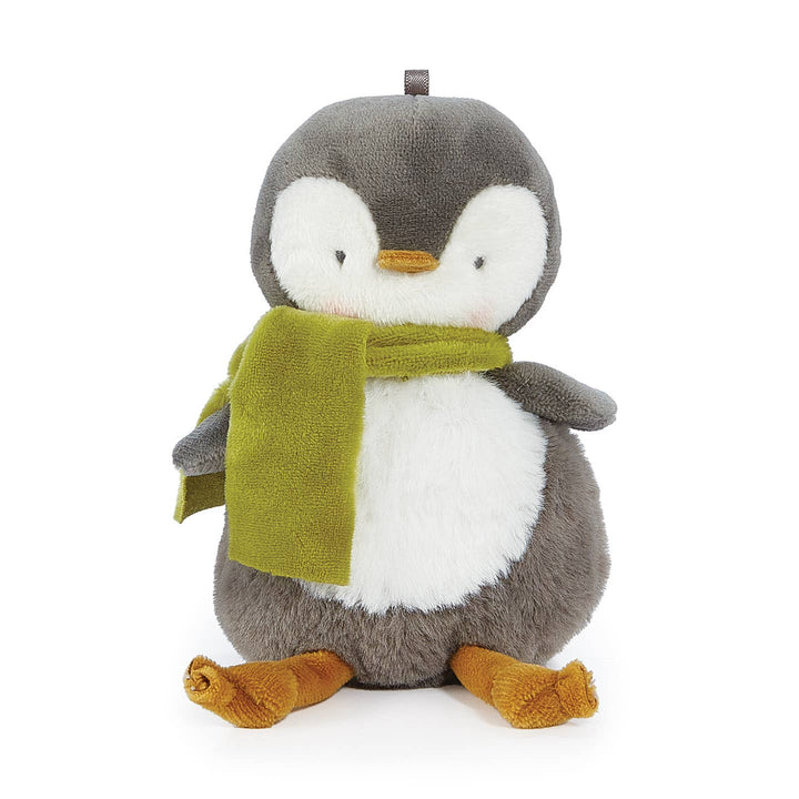 Plush penguin toy with a green scarf on a white background