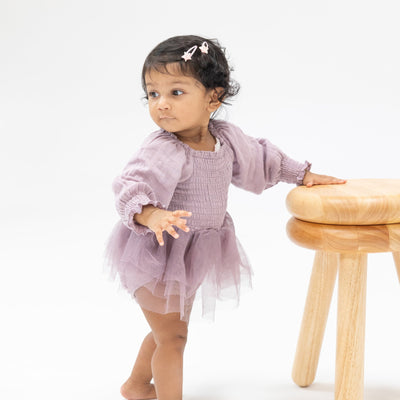 Baby girl modeling the bubble with tutu skirt attached 