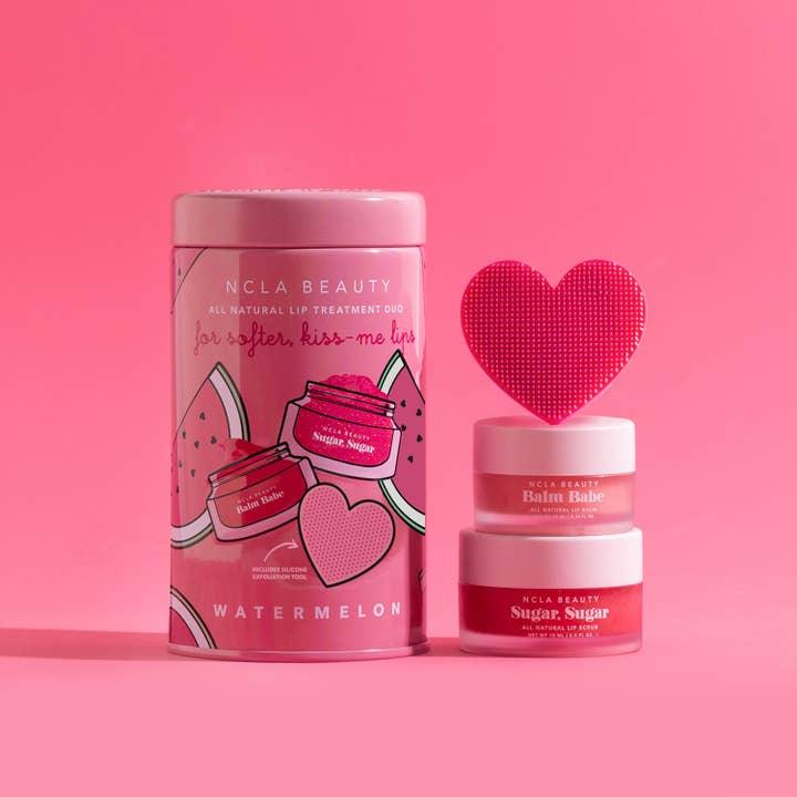 another picture of the lip balm, lip mask in a watermelon tin with hearts on it. 