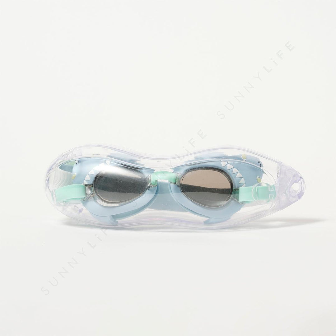 shark swim goggles in their plastic case. goggles are blue with green straps. 