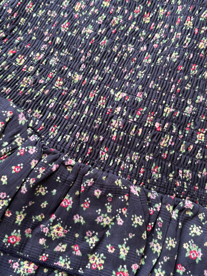 Navy blue fabric with small floral pattern