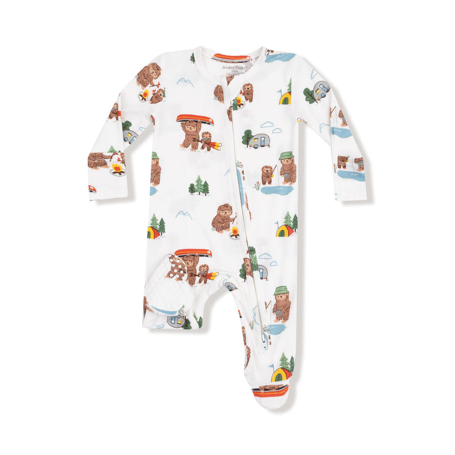 Children's onesie with bear and nature pattern on a white background