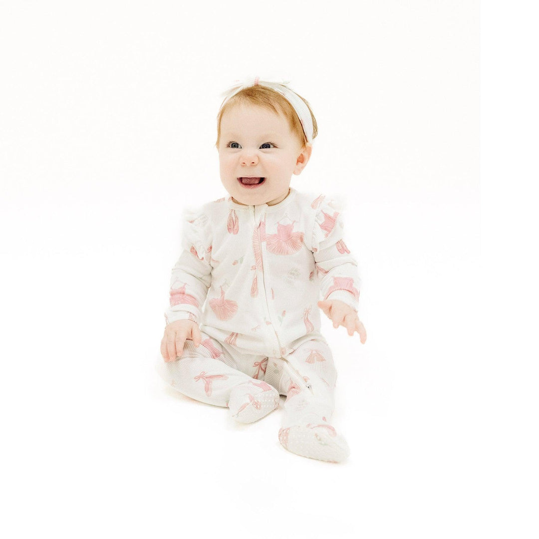baby girl wearing the ballet onesie
