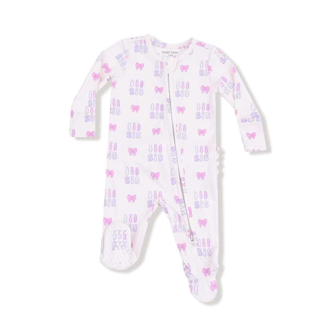 Baby onesie with 'lil sis' written pattern on a white background