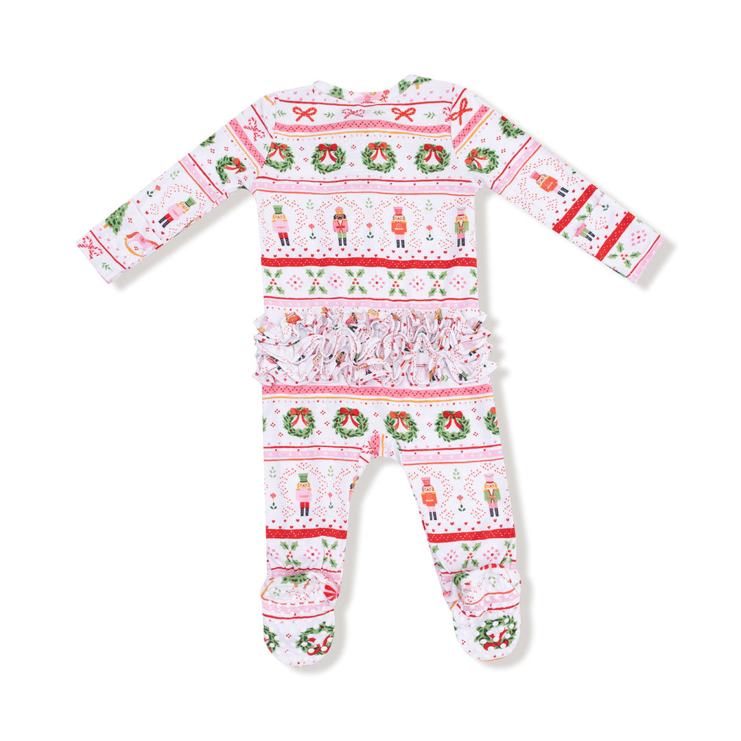 back of Christmas-themed baby onesie with festive patterns on a white background