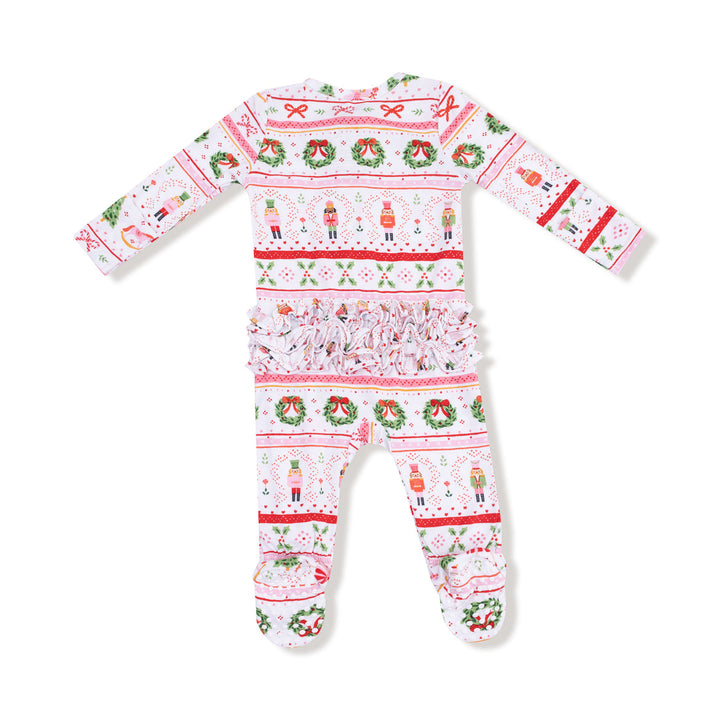 back of Christmas-themed baby onesie with festive patterns on a white background