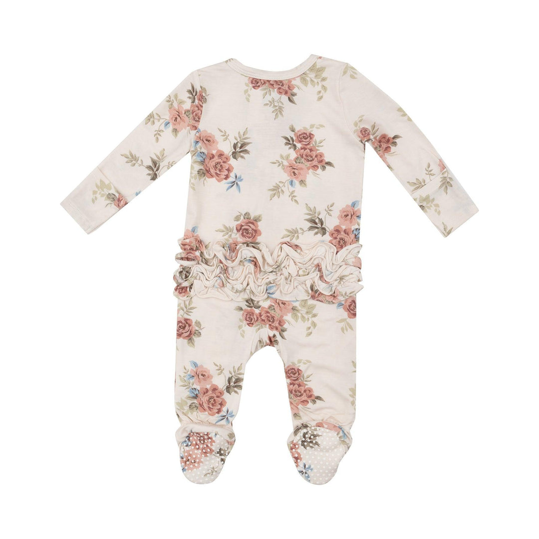 back of baby footie with roses all over it. there are ruffles on the bum.
