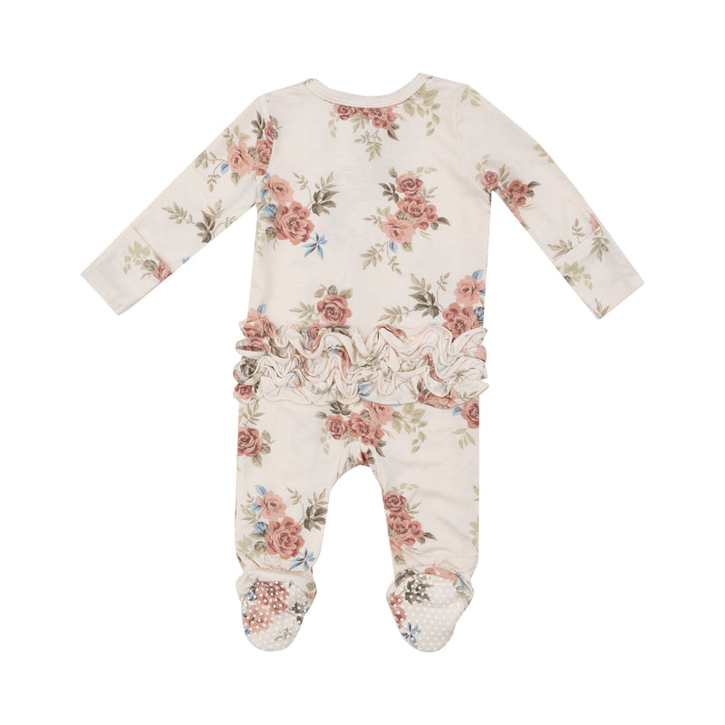 back of baby footie with roses all over it. there are ruffles on the bum.