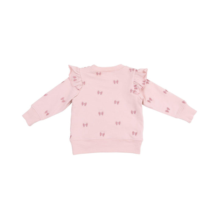 back of sweatshirt with ruffles at the shoulders. pink bows embroidered on the sweatshirt. 