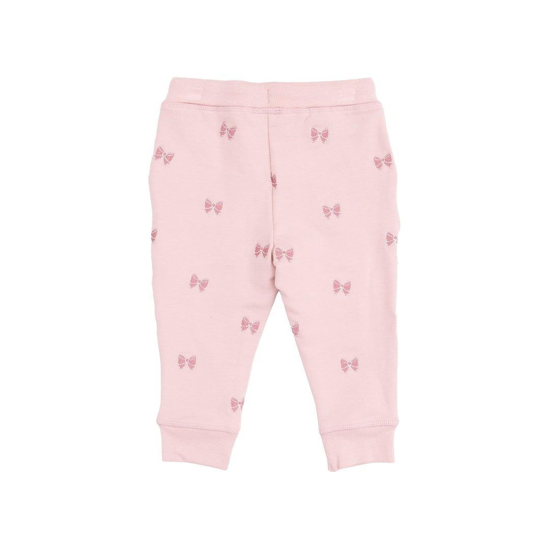 sweatpants embroidered with pink bows on them. 
