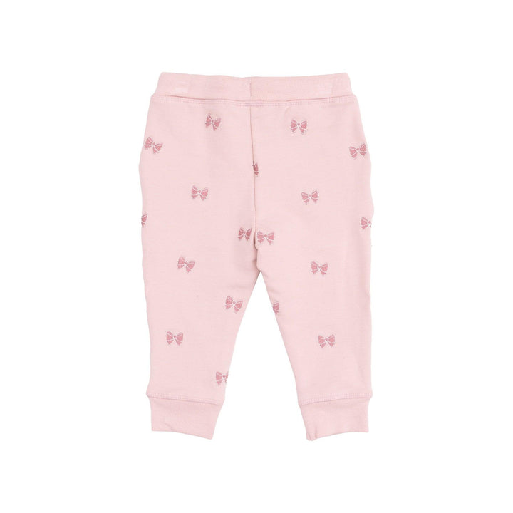 sweatpants embroidered with pink bows on them. 