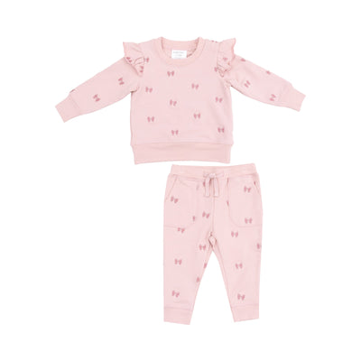 sweatset pink with ruffles by the sleeves, pink bows embroidered on the sweatshirt and sweatpants. drawstring on the pants 