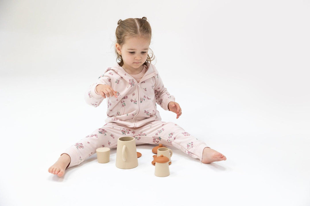 baby modeling the pink floral jogger set 