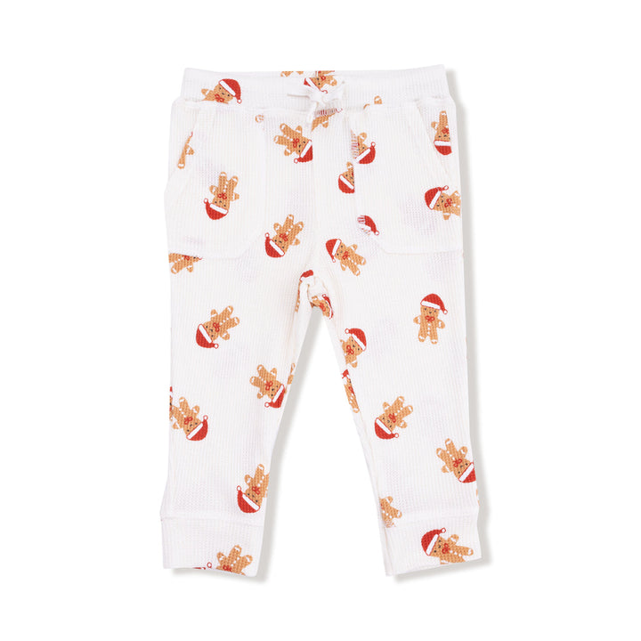 White pants with gingerbread man pattern on a white background