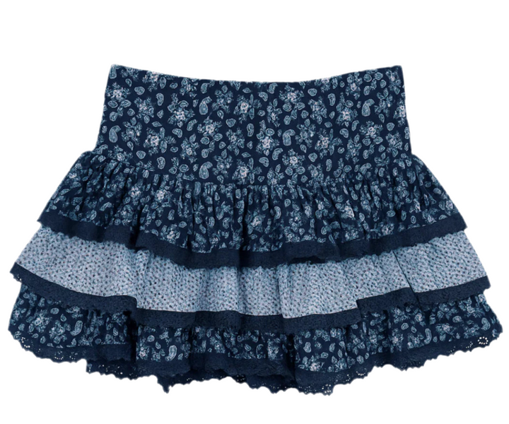 Navy blue floral skirt with ruffled layers on a white background