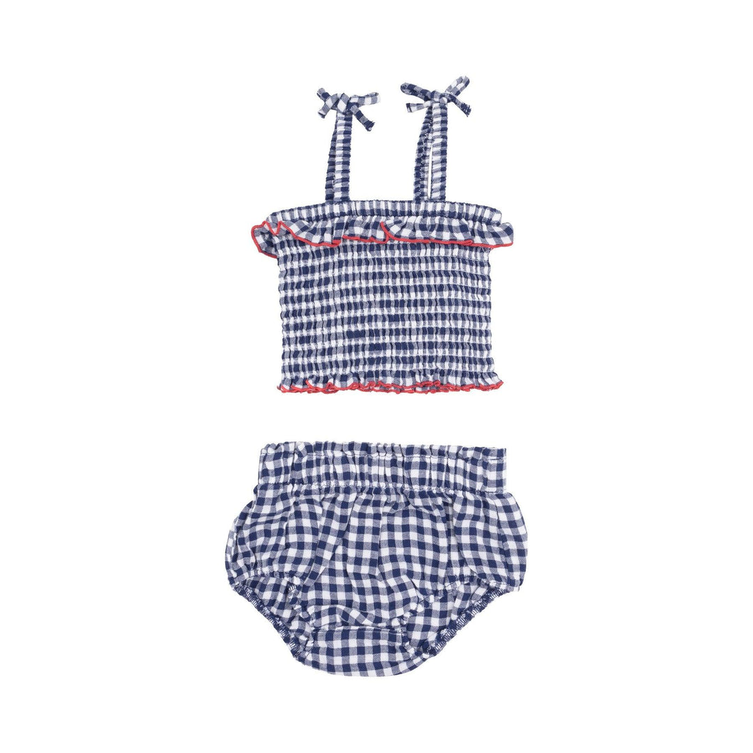navy and white gingham top and bloomer set , the top has a ruffle and the top has red trim around the top and bottom. 