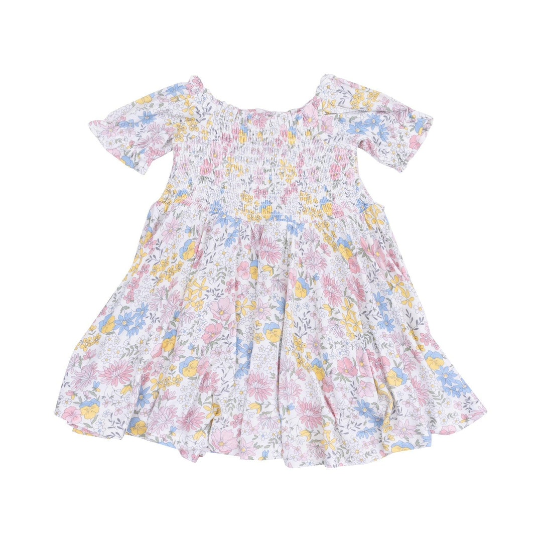 floral dress with soft pastel florals all over the dress. smocking at the top and full twirl skirt on the bottom. 
