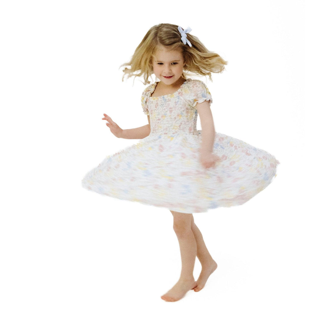 little girl twirling around in the soft floral dress. 