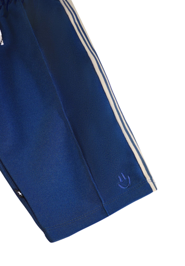 Blue tracksuit with white stripes on a white background