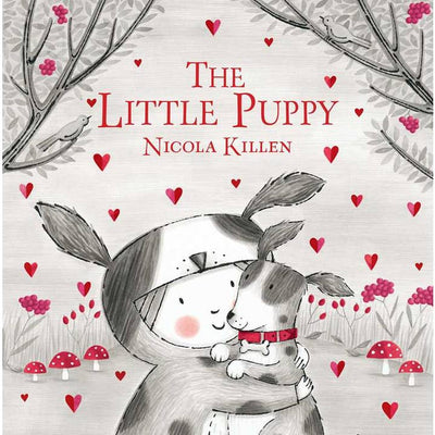 hardcover book titled "The Little Puppy"  with a little boy and a puppy on the front with heads and mushrooms on the cover. 