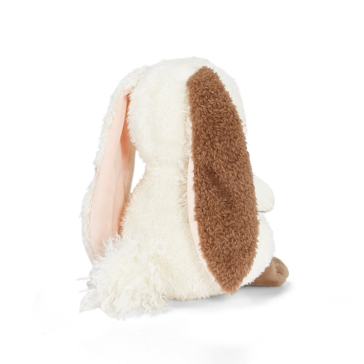 Back of Plush toy rabbit with white and brown fur on a white background