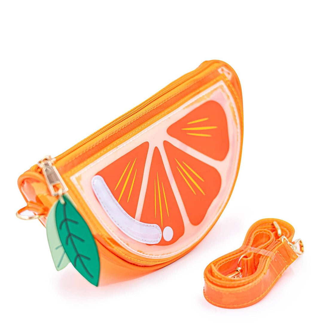 sideview of the orange slice handbag with detachable strap. 