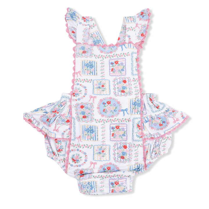 Baby romper with floral pattern on a white background