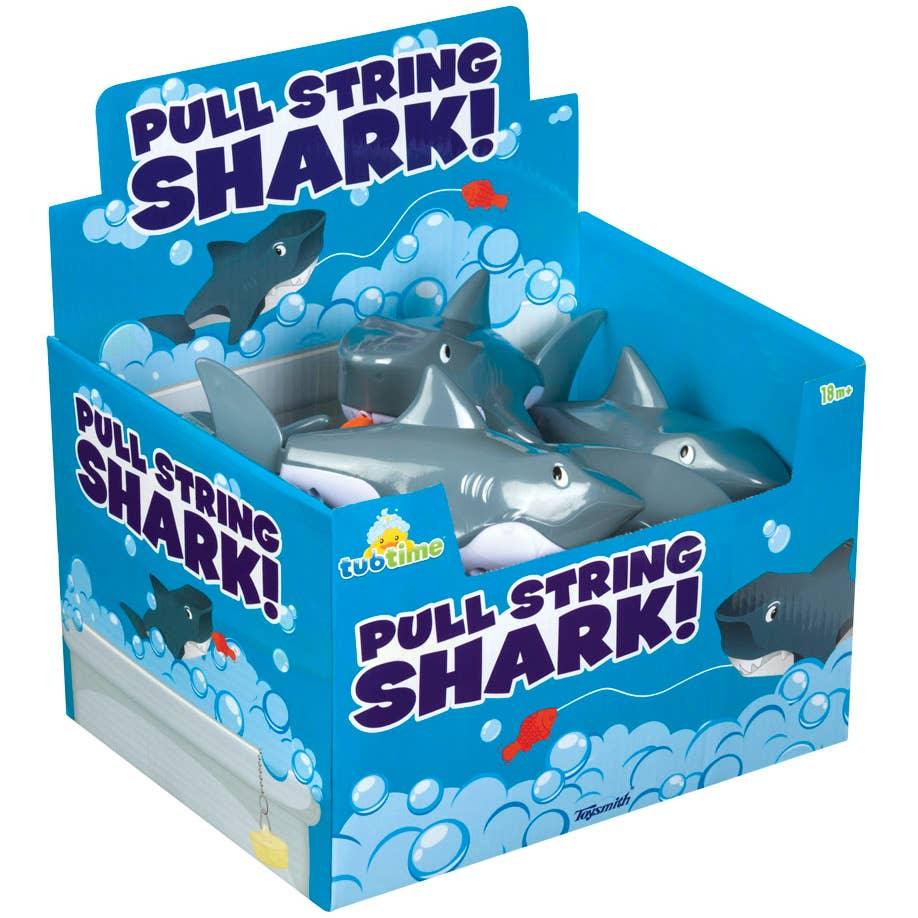 the store display for the pull string sharks. blue box with bubbles and pictures of sharks. 