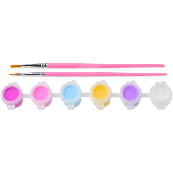 Set of paintbrushes with colorful paint containers on a white background