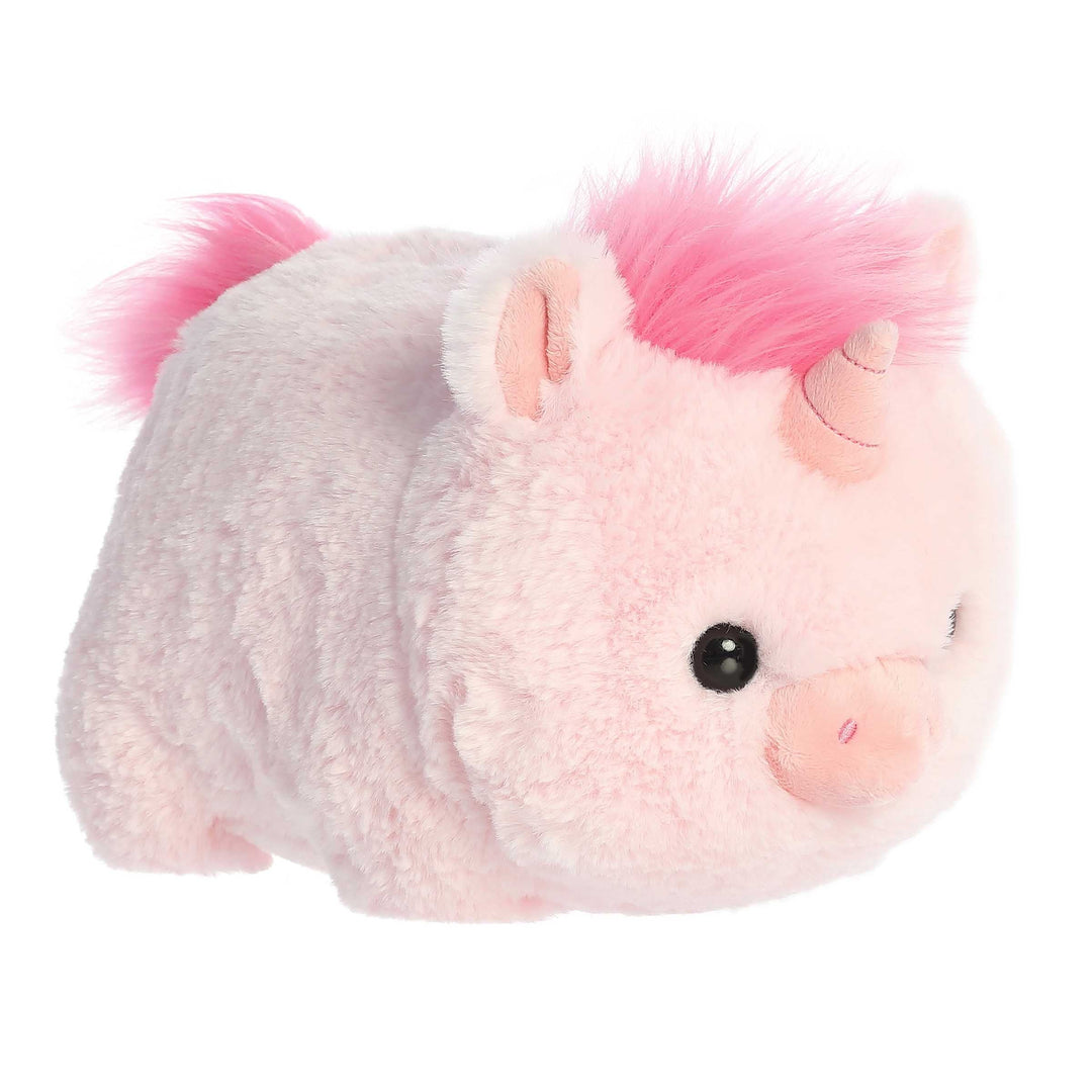 Plush toy resembling a unicorn with pink hair on a white background