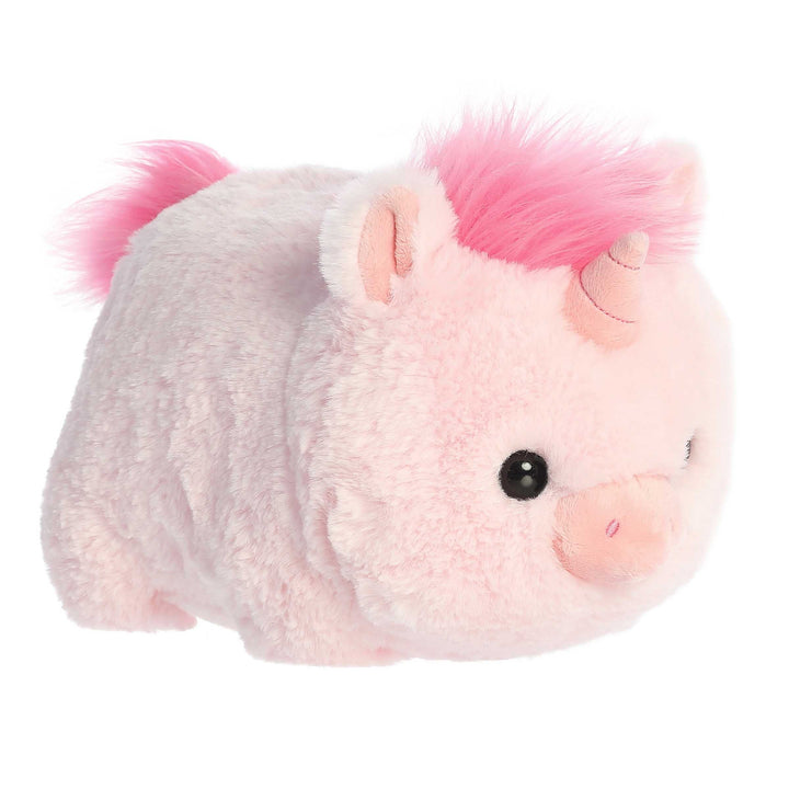 Plush toy resembling a unicorn with pink hair on a white background