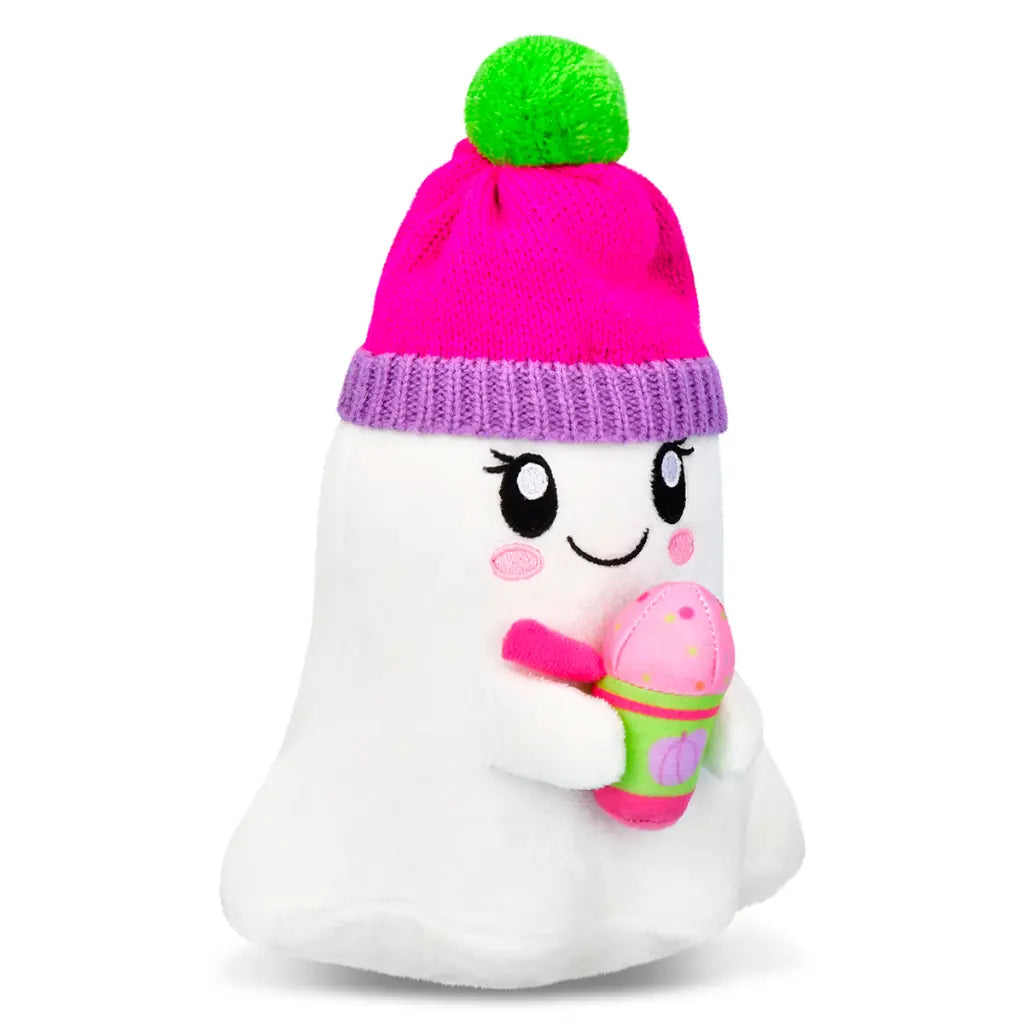 White Ghost plush toy with a pink hat and green pom-pom, holding a pink and green toy holding a hot drink 