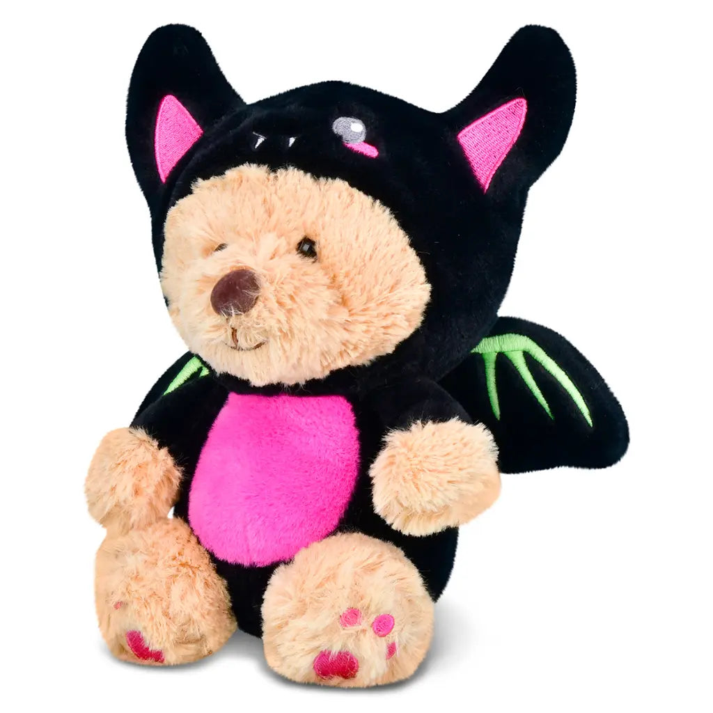 Plush toy bear in a black bat costume with pink interior and green accents on a white background