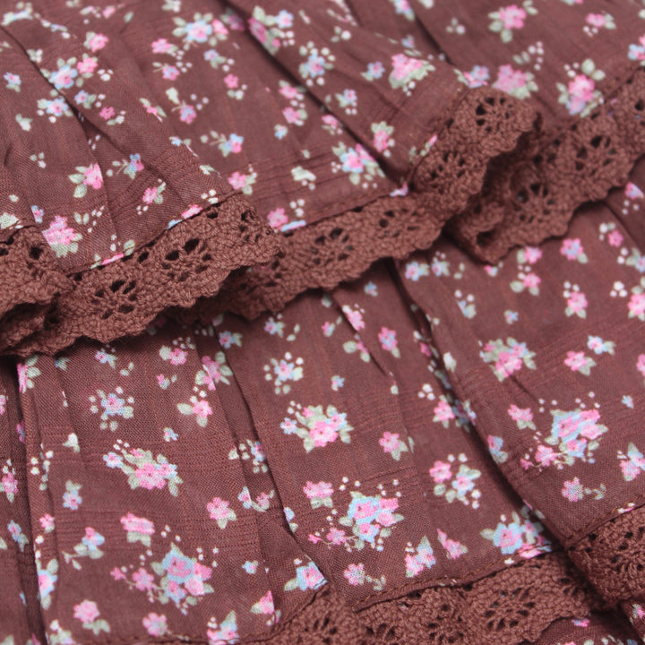 Brown fabric with floral pattern and lace trim