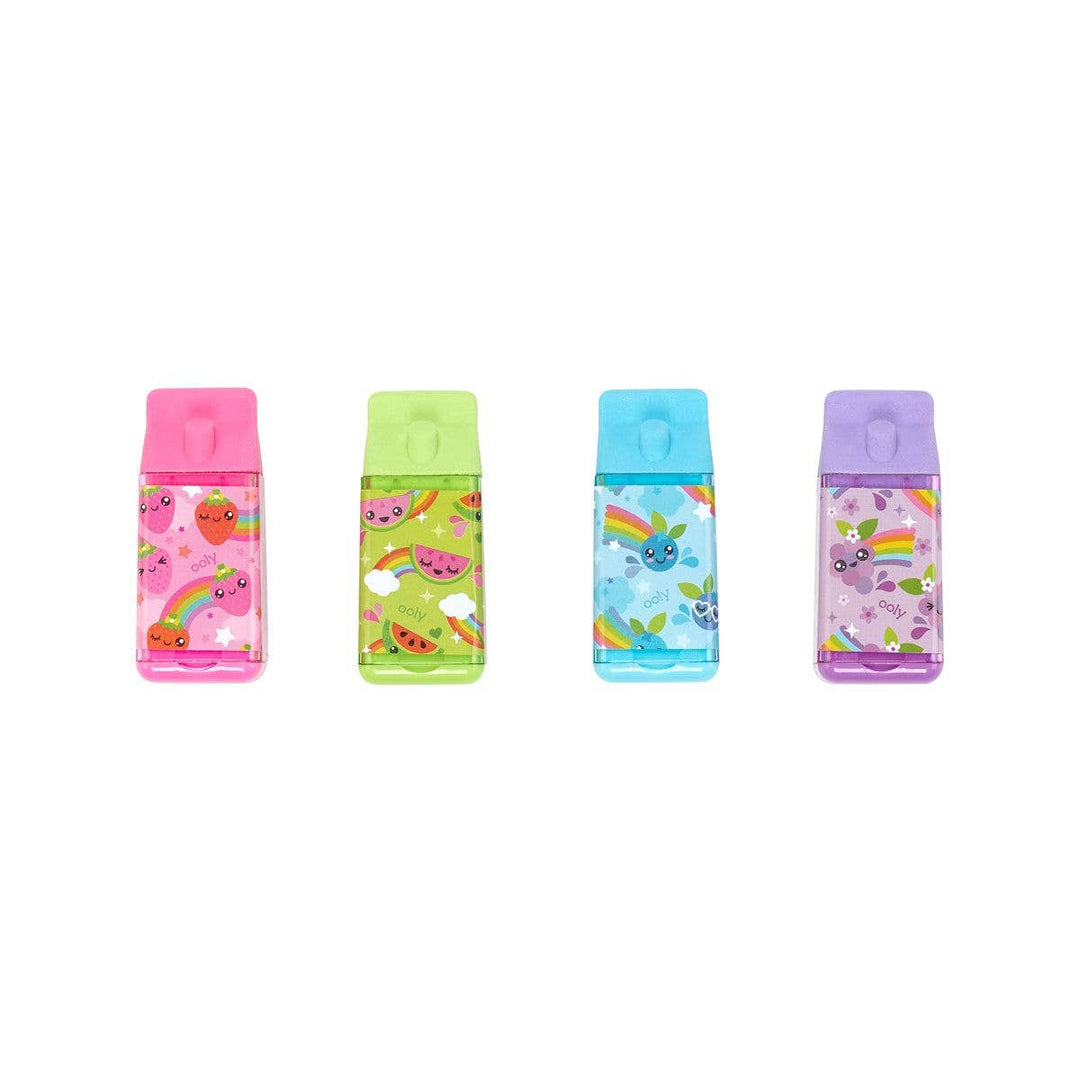 4 different pencil erasers shaped like juice boxes. each in a different color: purple, pink, blue, green. 