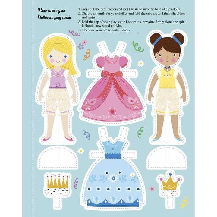 picture of paper dolls in the book and two dresses. 
