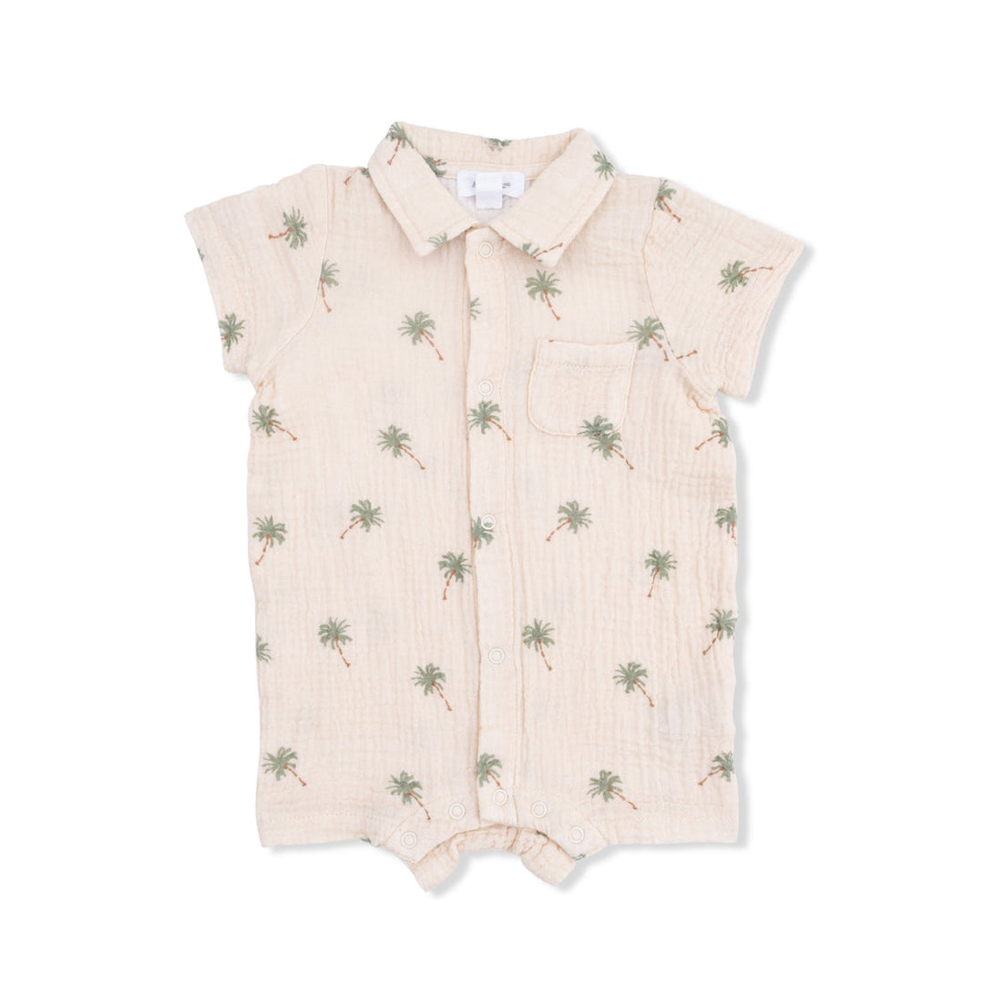 Beige baby romper with palm tree pattern on a white background