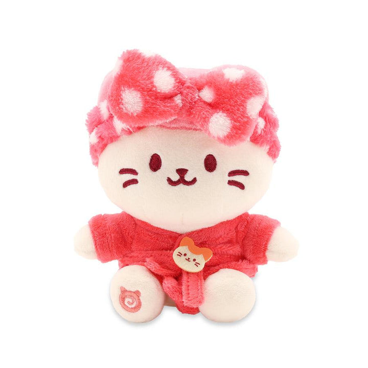 sitting kitty in a red plush robe and plush headband with polka dots on it.